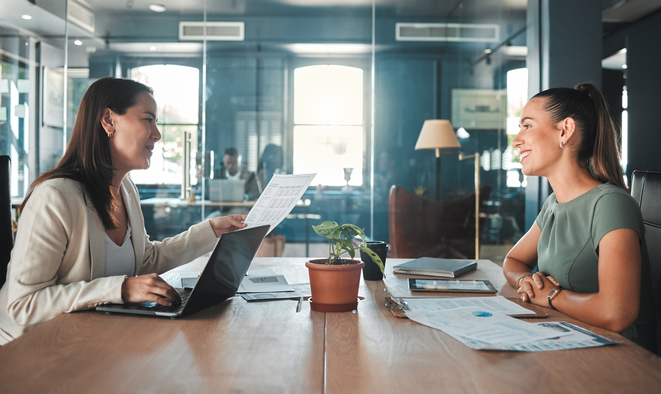 Businesswoman in a job interview discussing the role of COO with HR manager, illustrating the process to hire a COO